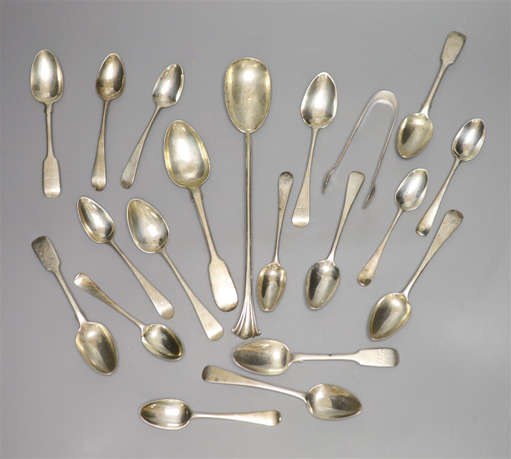 A group of assorted silver teaspoons and other mixed silver flatware, including salad serving spoon, 13.5 oz.